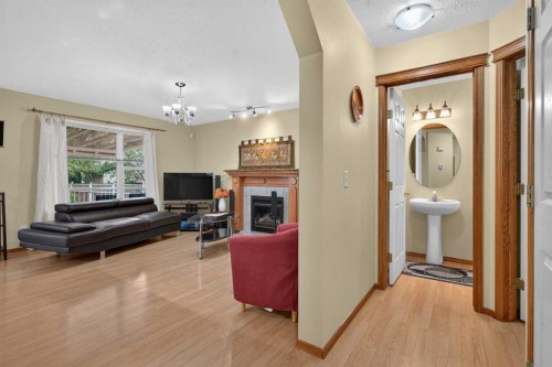 45 Arbour Crest Terrace Nw, Calgary, AB - Indoor Photo Showing Other Room With Fireplace