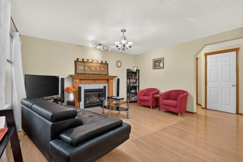 45 Arbour Crest Terrace Nw, Calgary, AB - Indoor Photo Showing Living Room With Fireplace