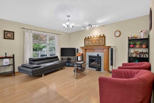 45 Arbour Crest Terrace Nw, Calgary, AB - Indoor Photo Showing Living Room With Fireplace