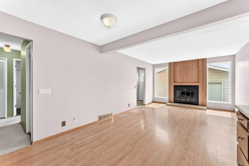 128 Erin Woods Drive Se, Calgary, AB - Indoor With Fireplace