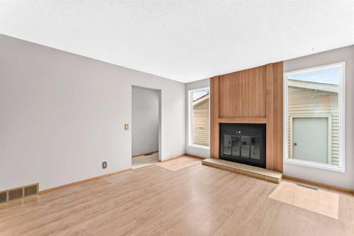128 Erin Woods Drive Se, Calgary, AB - Indoor With Fireplace