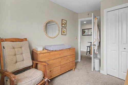 3407-403 Mackenzie Way Sw, Airdrie, AB - Indoor Photo Showing Bedroom