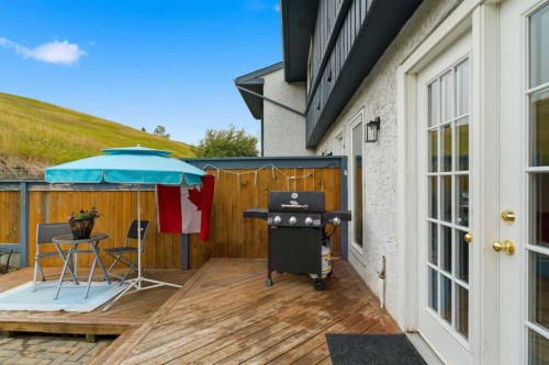 12-800 Bowcroft Place, Cochrane, AB - Outdoor With Deck Patio Veranda With Exterior