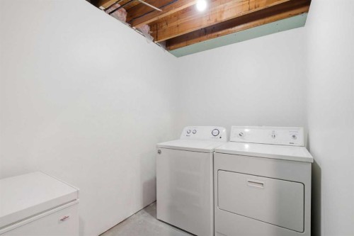 12-800 Bowcroft Place, Cochrane, AB - Indoor Photo Showing Laundry Room