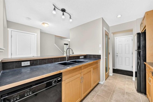 108 Sage Valley Drive Nw, Calgary, AB - Indoor Photo Showing Kitchen With Double Sink