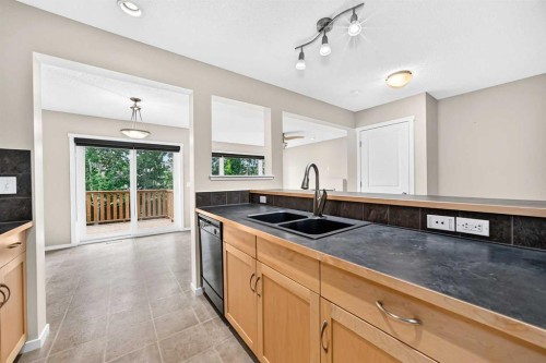 108 Sage Valley Drive Nw, Calgary, AB - Indoor Photo Showing Kitchen With Double Sink