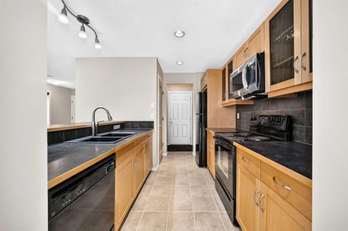 108 Sage Valley Drive Nw, Calgary, AB - Indoor Photo Showing Kitchen With Double Sink