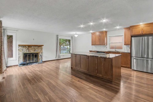 115 Mckenna Crescent Se, Calgary, AB - Indoor With Fireplace