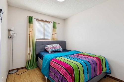 1916B 29 Avenue, Nanton, AB - Indoor Photo Showing Bedroom