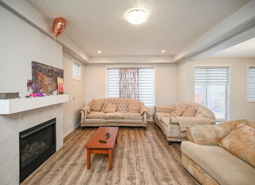 64 Cityside Common Ne, Calgary, AB - Indoor Photo Showing Living Room With Fireplace