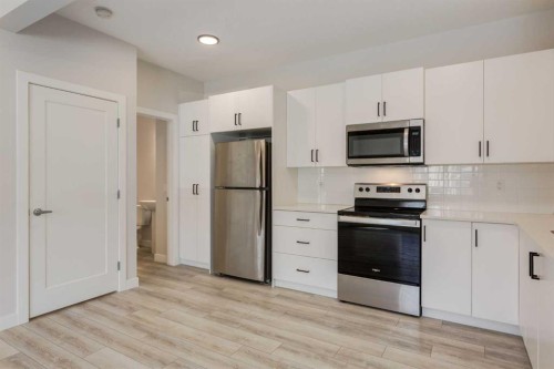31 Tuscany Summit Square Nw, Calgary, AB - Indoor Photo Showing Kitchen With Stainless Steel Kitchen