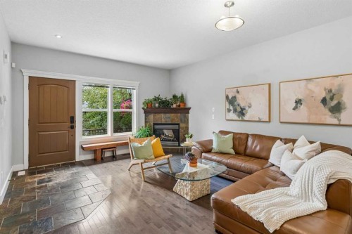 2-441 20 Avenue Ne, Calgary, AB - Indoor Photo Showing Living Room With Fireplace