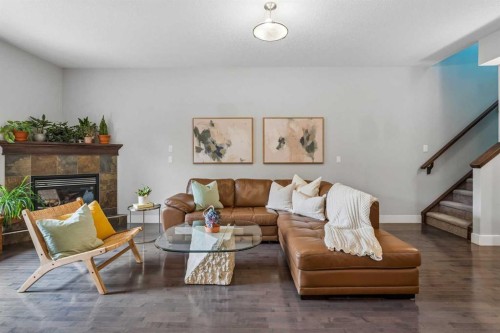 2-441 20 Avenue Ne, Calgary, AB - Indoor Photo Showing Living Room With Fireplace