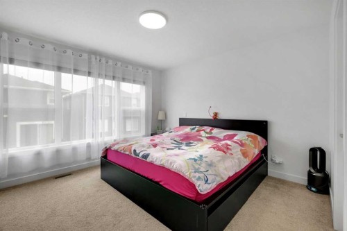 89 Amblehurst Gardens Nw, Calgary, AB - Indoor Photo Showing Bedroom
