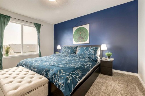 497 Hillcrest Road Sw, Airdrie, AB - Indoor Photo Showing Bedroom