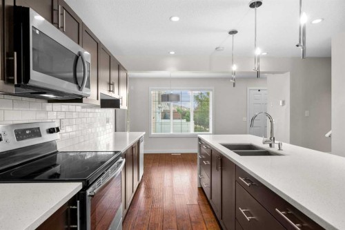 89 Pantego Lane Nw, Calgary, AB - Indoor Photo Showing Kitchen With Double Sink With Upgraded Kitchen