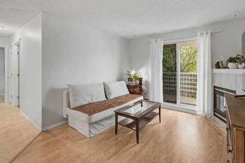 101-7724 Bowness Road Nw, Calgary, AB - Indoor Photo Showing Living Room