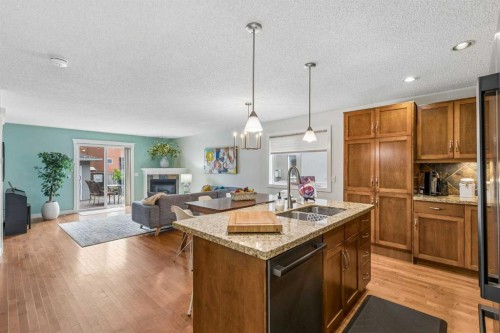 3444 3 Avenue Nw, Calgary, AB - Indoor Photo Showing Kitchen With Fireplace With Double Sink