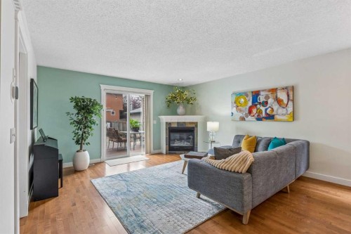3444 3 Avenue Nw, Calgary, AB - Indoor Photo Showing Living Room With Fireplace