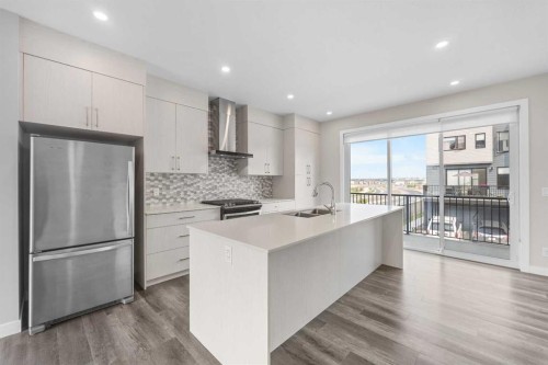 615 Evanston Link Nw, Calgary, AB - Indoor Photo Showing Kitchen With Stainless Steel Kitchen With Double Sink With Upgraded Kitchen