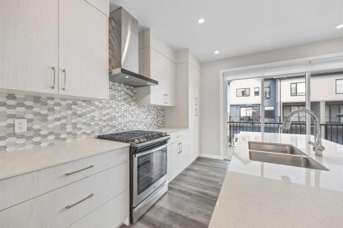 615 Evanston Link Nw, Calgary, AB - Indoor Photo Showing Kitchen With Stainless Steel Kitchen With Double Sink With Upgraded Kitchen