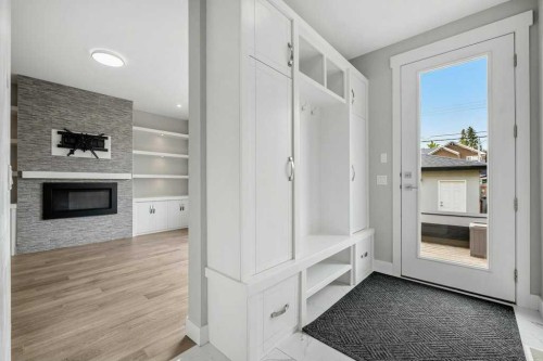 637 14 Avenue Ne, Calgary, AB - Indoor Photo Showing Other Room With Fireplace