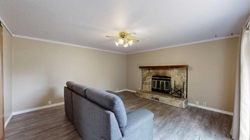 348 47 Avenue West, Claresholm, AB - Indoor With Fireplace