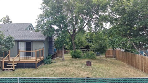 348 47 Avenue West, Claresholm, AB - Outdoor With Above Ground Pool With Deck Patio Veranda