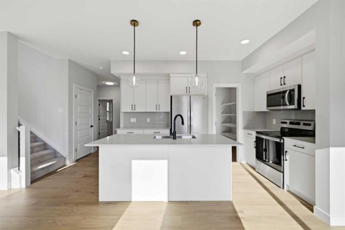 42 Waterford Mews, Chestermere, AB - Indoor Photo Showing Kitchen With Upgraded Kitchen
