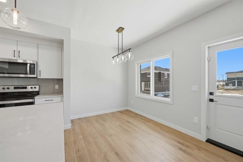 42 Waterford Mews, Chestermere, AB - Indoor Photo Showing Kitchen