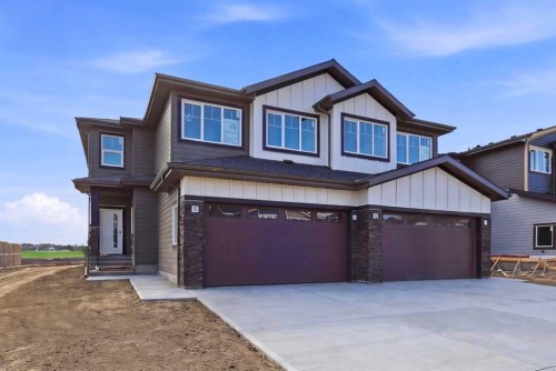 42 Waterford Mews, Chestermere, AB - Outdoor With Facade