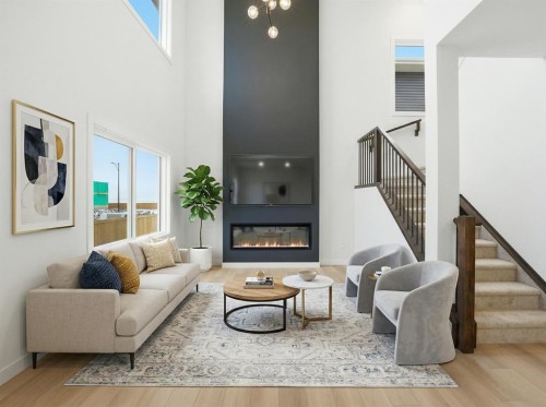 46 Waterford Mews, Chestermere, AB - Indoor Photo Showing Living Room With Fireplace