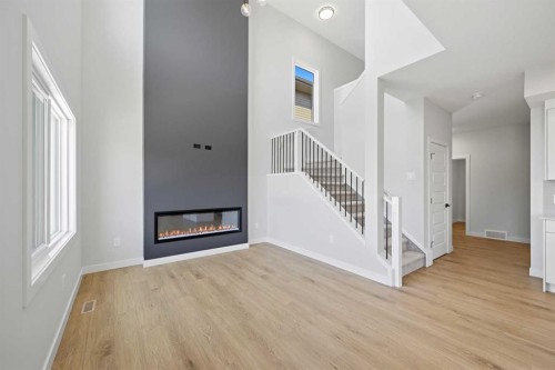 46 Waterford Mews, Chestermere, AB - Indoor With Fireplace