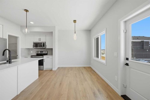 46 Waterford Mews, Chestermere, AB - Indoor Photo Showing Kitchen With Double Sink