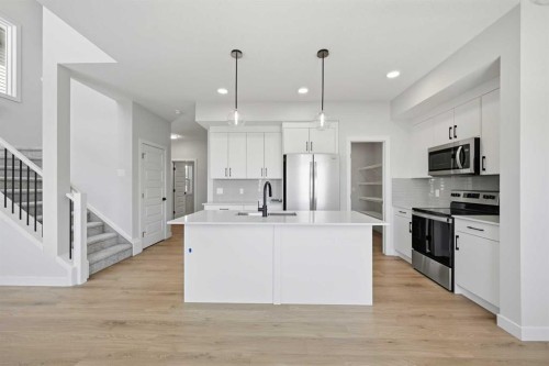 46 Waterford Mews, Chestermere, AB - Indoor Photo Showing Kitchen With Upgraded Kitchen