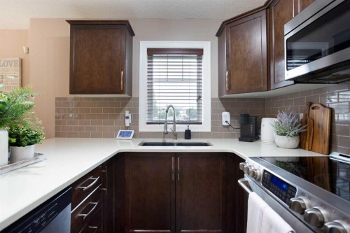1575 Windstone Road Sw, Airdrie, AB - Indoor Photo Showing Kitchen