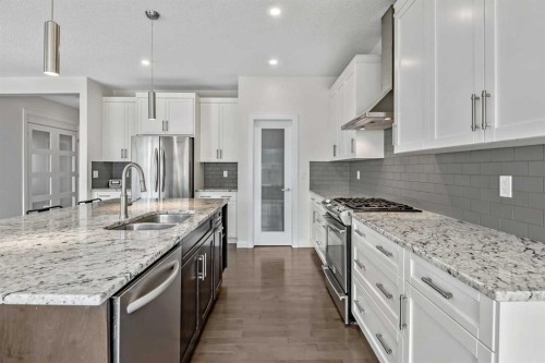 41 Westridge Road, Okotoks, AB - Indoor Photo Showing Kitchen With Double Sink With Upgraded Kitchen