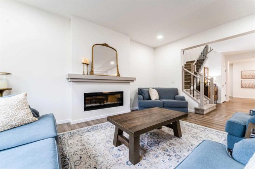156 Savanna Drive Ne, Calgary, AB - Indoor Photo Showing Living Room With Fireplace