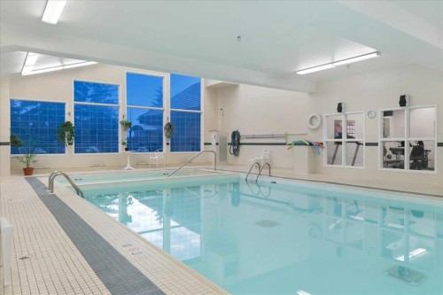 202-4512 52 Avenue, Red Deer, AB - Indoor Photo Showing Other Room With In Ground Pool