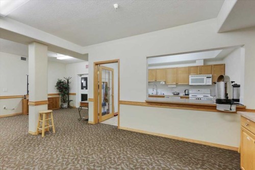 202-4512 52 Avenue, Red Deer, AB - Indoor Photo Showing Kitchen