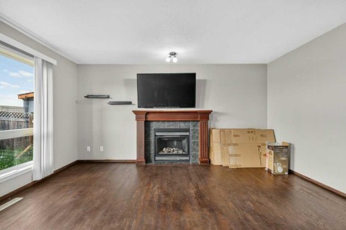88 Everglen Rise Sw, Calgary, AB - Indoor Photo Showing Living Room With Fireplace