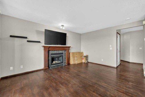 88 Everglen Rise Sw, Calgary, AB - Indoor Photo Showing Living Room With Fireplace