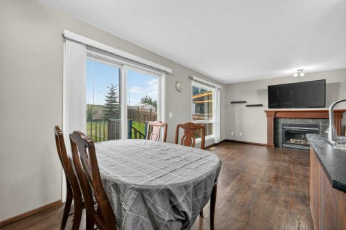 88 Everglen Rise Sw, Calgary, AB - Indoor Photo Showing Dining Room With Fireplace