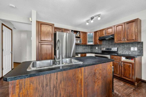 88 Everglen Rise Sw, Calgary, AB - Indoor Photo Showing Kitchen With Double Sink