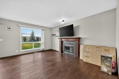 88 Everglen Rise Sw, Calgary, AB - Indoor Photo Showing Living Room With Fireplace