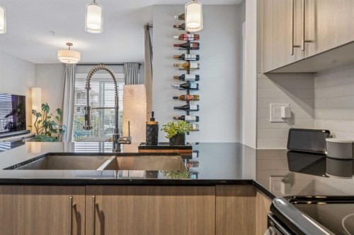 3317-11 Mahogany Row Se, Calgary, AB - Indoor Photo Showing Kitchen With Double Sink