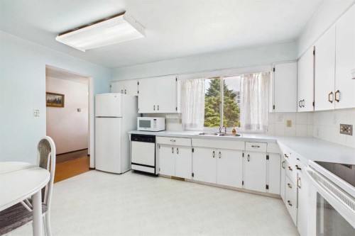 2012 Urbana Road Nw, Calgary, AB - Indoor Photo Showing Kitchen With Double Sink