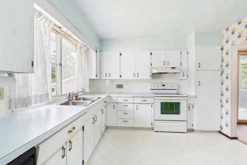 2012 Urbana Road Nw, Calgary, AB - Indoor Photo Showing Kitchen With Double Sink