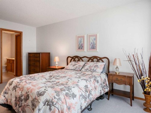 277 Arbour Cliff Close Nw, Calgary, AB - Indoor Photo Showing Bedroom