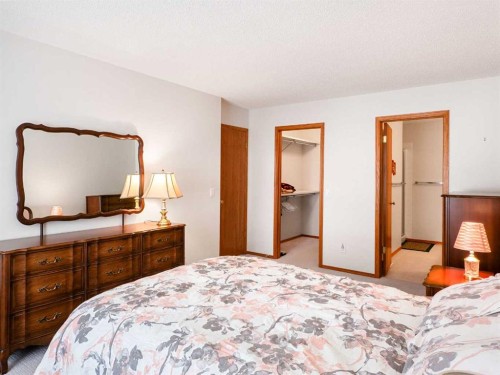 277 Arbour Cliff Close Nw, Calgary, AB - Indoor Photo Showing Bedroom